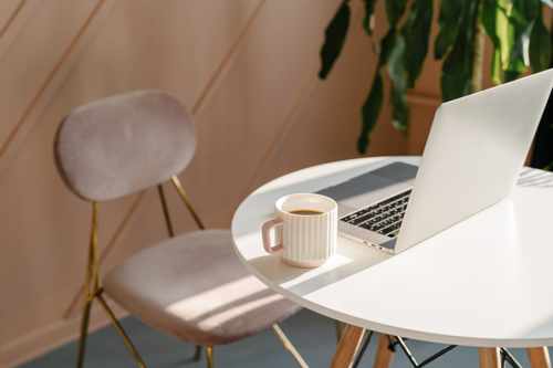 A quiet workspace with a laptop and coffee